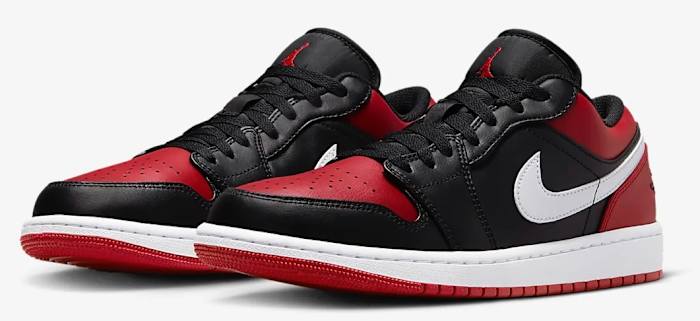 Side view of red and black Air Jordan sneakers.